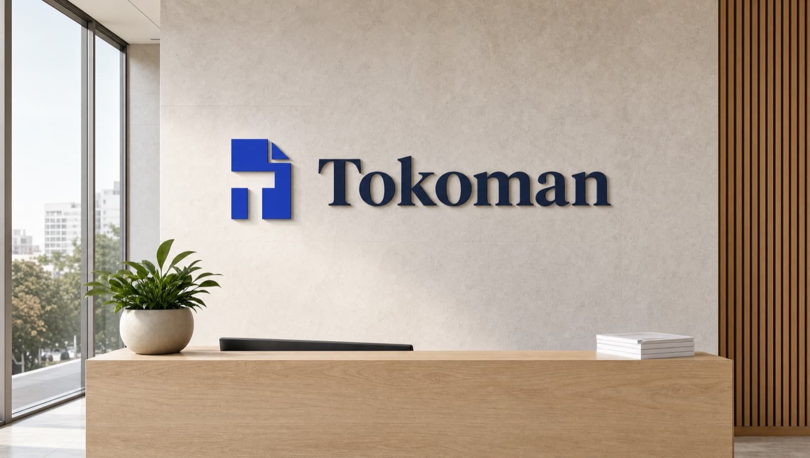 The Tokoman mark on a reception wall